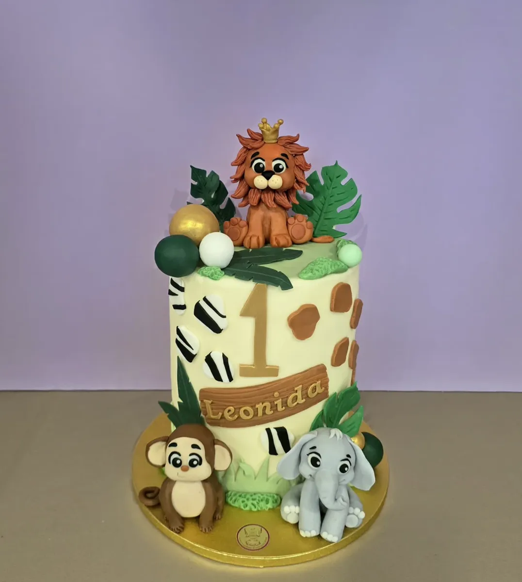 Torta per il primo compleanno con leoncino, scimmietta ed elefantino
